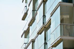 Glass apartment building“width=
