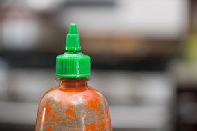 Sriracha hot sauce with the green cap