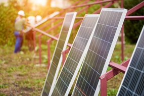 Solar panels awaiting ground-mounting