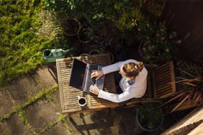 Woman working from home in her garden