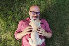 Man playing with his dog