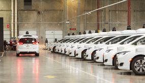 Waymo autonomous cars lined up and ready to roll