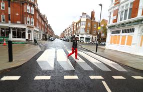A woman seen crossing the UK's first '3D' zebra which has...
