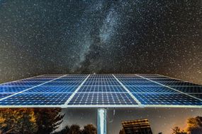 Solar panels under the night sky